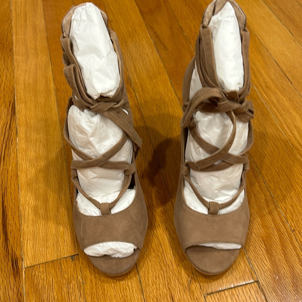 Vince Camuto beige sided peep toe pumps with wrap around laces. New and unworn.
